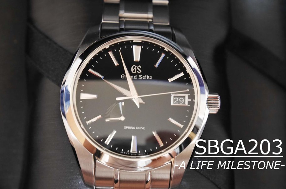 グランドセイコー SBGA203 スプリングドライブの正面画像。深い黒の文字盤と、ザラツ研磨が施されたステンレスケースの輝きが際立つ外観。